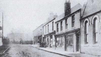 Front Street Trimdon Grange - showing the old Dove Cote, the Wesleyan Chapel and part of the signal box. The shop next to the chapel was pulled down to make the new road. 