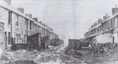 The rear of houses in Oswald Row (right) and Thomas Street - The Plantation.
